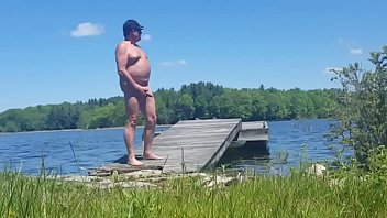 Old man walks around lake naked