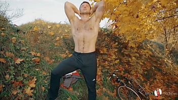 Nude gay bear cyclist stripping and masterbating under the autumn tree